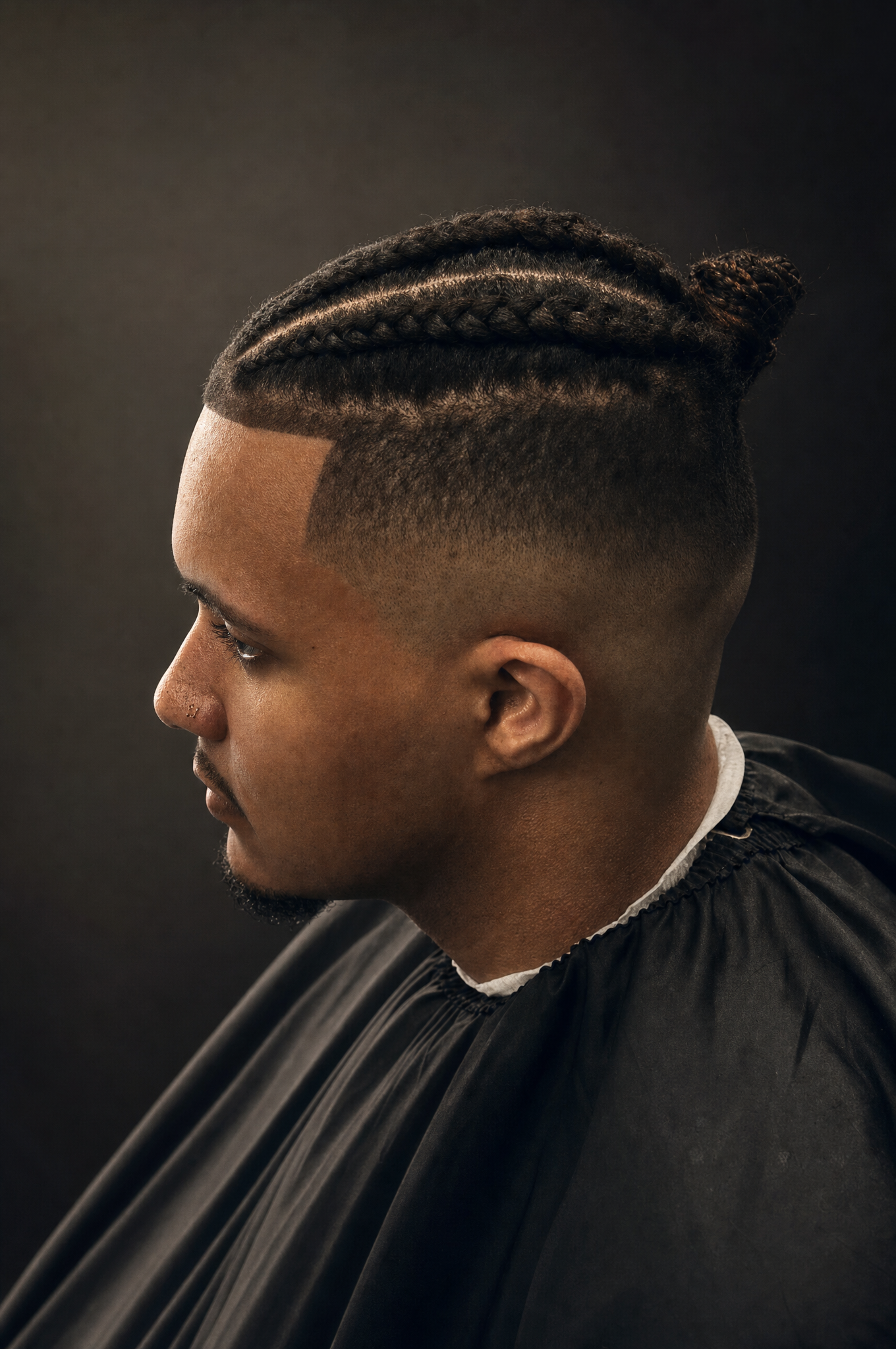 Corte con trenzas y fade alto realizado en Anyelo RD Barbershop